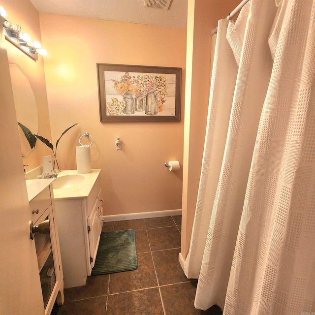 1407 W Front St, Heber Springs, AR 72543 - bathroom featuring vanity, tile patterned floors, and a shower with shower curtain