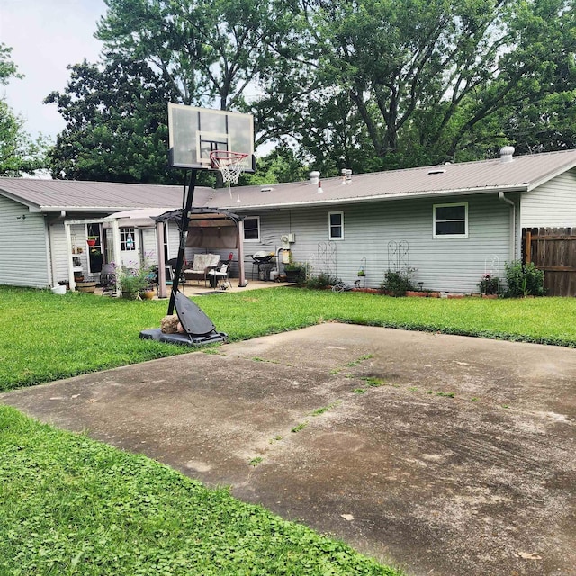 1407 W Front St, Heber Springs, AR 72543 - back of house featuring a patio and a metal roof