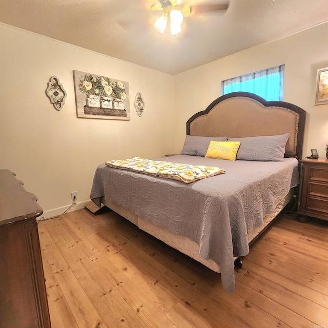 1407 W Front St, Heber Springs, AR 72543 - bedroom with hardwood / wood-style flooring and a ceiling fan