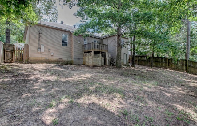 12825 Westglen Dr, Little Rock, AR 72211 - rear view of house featuring a fenced backyard, crawl space, and a wooden deck