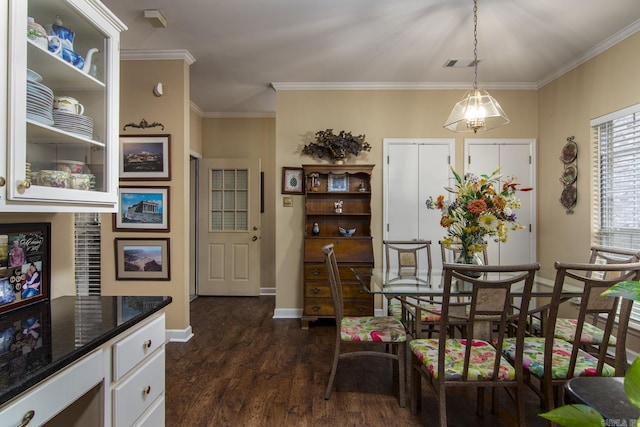 1315 Gleneagles Ct, Little Rock, AR 72211 - dining room with dark wood-type flooring and crown molding