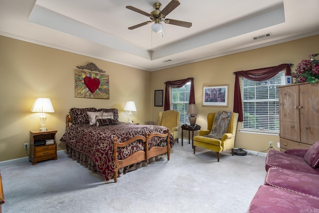 1315 Gleneagles Ct, Little Rock, AR 72211 - bedroom featuring a raised ceiling, carpet floors, multiple windows, and ornamental molding