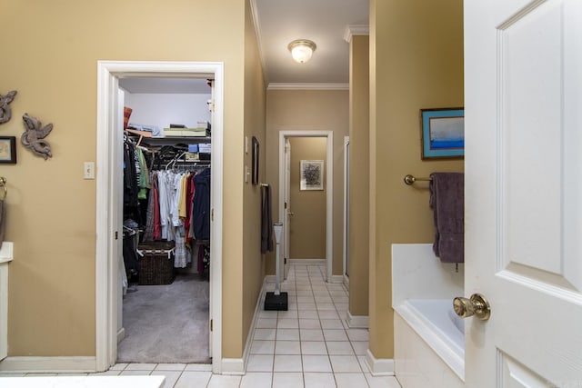 1315 Gleneagles Ct, Little Rock, AR 72211 - bathroom featuring a stall shower, tile patterned floors, a garden tub, ornamental molding, and a walk in closet