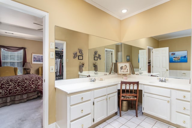 1315 Gleneagles Ct, Little Rock, AR 72211 - ensuite bathroom with double vanity, crown molding, a closet, tile patterned floors, and recessed lighting