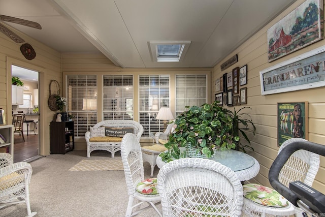 1315 Gleneagles Ct, Little Rock, AR 72211 - sunroom / solarium with wood walls, carpet floors, and outdoor dining area