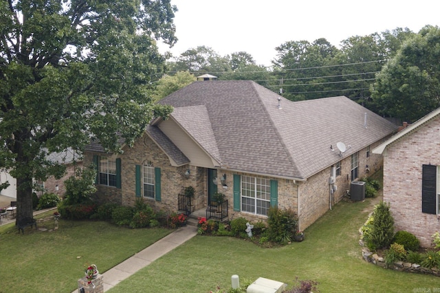 1315 Gleneagles Ct, Little Rock, AR 72211 - view of front of home with brick siding, a front lawn, and roof with shingles