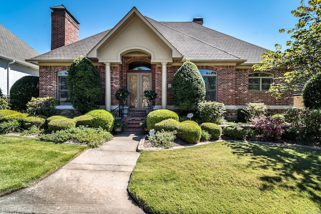 103 Falata Cir, Little Rock, AR 72223 - view of front of property featuring brick siding, french doors, and a chimney