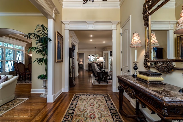 103 Falata Cir, Little Rock, AR 72223 - entrance foyer with a chandelier, arched walkways, wood finished floors, and crown molding
