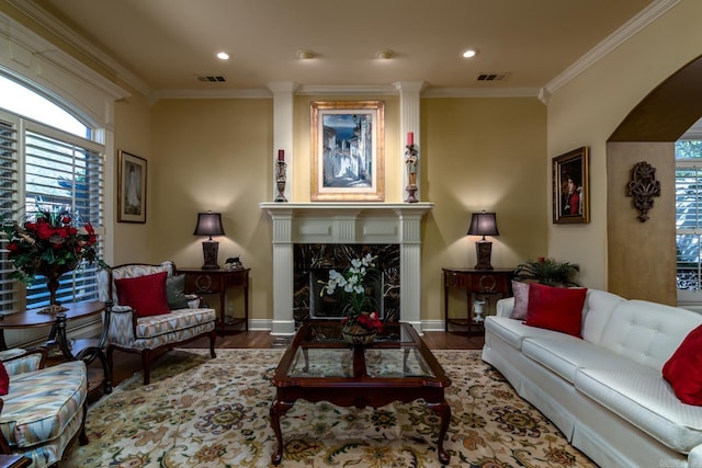 103 Falata Cir, Little Rock, AR 72223 - living room with wood finished floors, crown molding, healthy amount of natural light, recessed lighting, and a fireplace