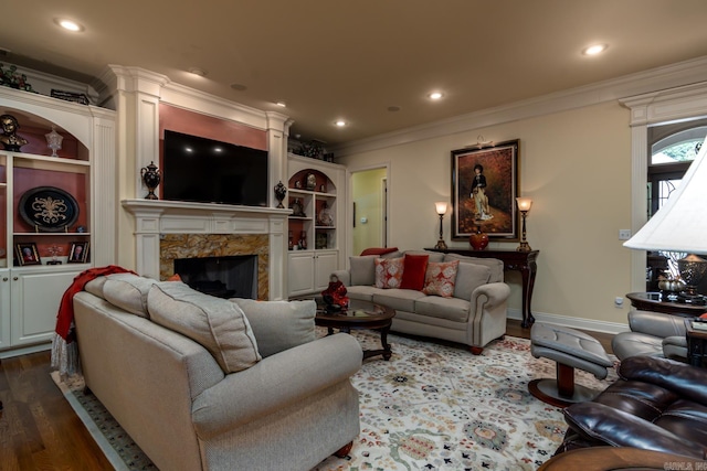 103 Falata Cir, Little Rock, AR 72223 - living room featuring dark wood-style flooring, a premium fireplace, crown molding, recessed lighting, and built in features