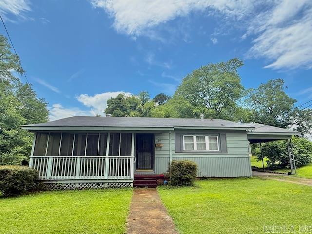 119 N 20th St, Arkadelphia, AR 71923 - view of front of house featuring a front lawn and a carport