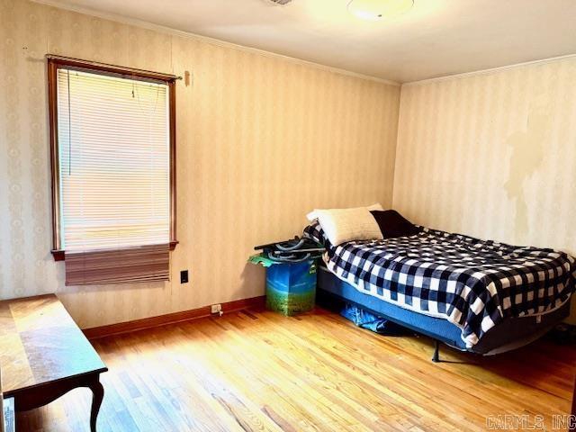 119 N 20th St, Arkadelphia, AR 71923 - bedroom featuring wood finished floors and crown molding
