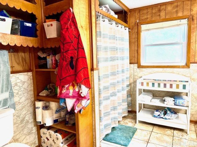 119 N 20th St, Arkadelphia, AR 71923 - full bath with tile patterned flooring and curtained shower