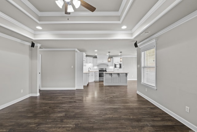 36 Fletcher Dr, Austin, AR 72007 - unfurnished living room featuring ceiling fan, a raised ceiling, crown molding, dark wood-style flooring, and recessed lighting