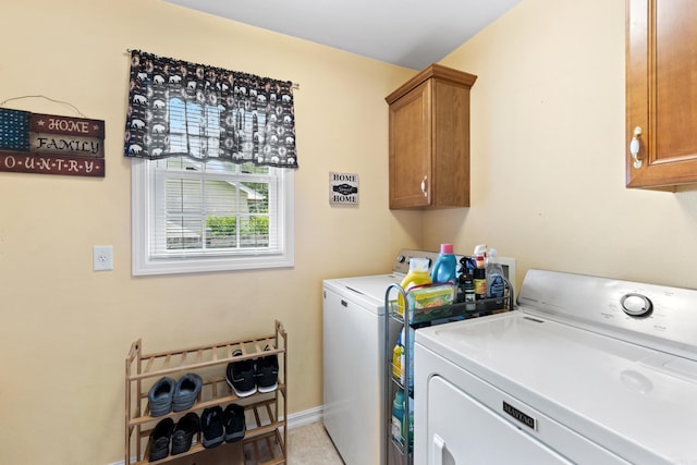 301 Forest Dr, Mountain Home, AR 72653 - laundry room featuring washing machine and clothes dryer, cabinet space, and light tile patterned floors
