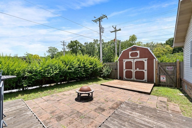 301 Forest Dr, Mountain Home, AR 72653 - fenced backyard featuring an outdoor fire pit, a shed, and a patio area