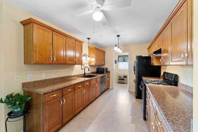 301 Forest Dr, Mountain Home, AR 72653 - kitchen featuring black gas stove, dishwasher, stainless steel microwave, ceiling fan, and brown cabinetry
