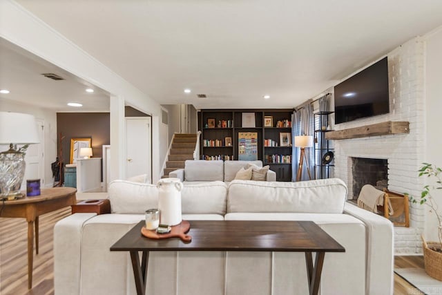 4 Coachlight Cir, Little Rock, AR 72227 - living area featuring wood finished floors, stairs, a fireplace, and recessed lighting