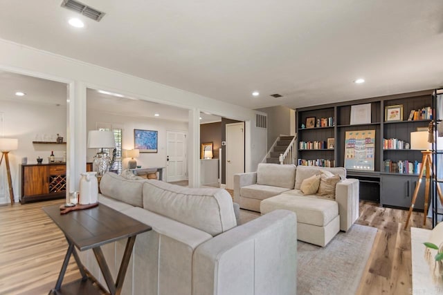 4 Coachlight Cir, Little Rock, AR 72227 - living area featuring light wood-style flooring, stairs, and recessed lighting
