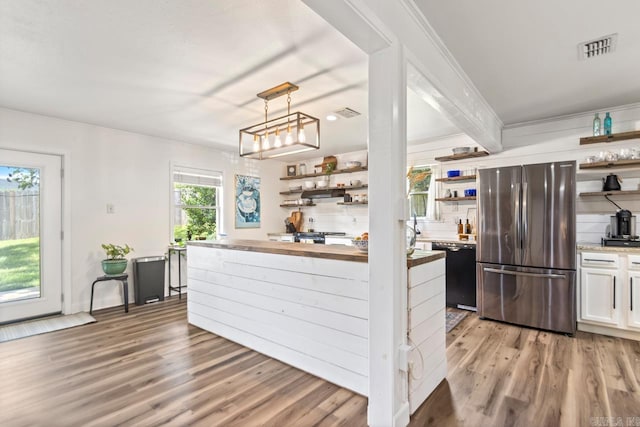 4 Coachlight Cir, Little Rock, AR 72227 - kitchen featuring open shelves, freestanding refrigerator, black dishwasher, butcher block counters, and light wood finished floors
