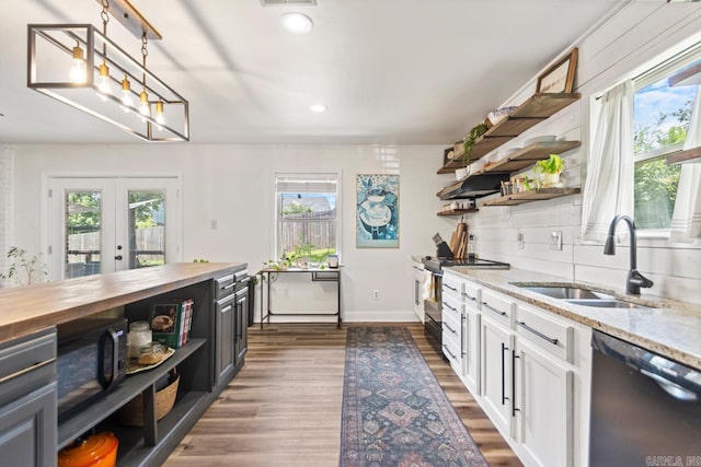 4 Coachlight Cir, Little Rock, AR 72227 - kitchen featuring open shelves, dishwashing machine, butcher block countertops, stainless steel electric range, and ornamental molding