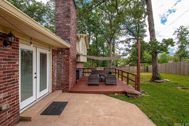 4 Coachlight Cir, Little Rock, AR 72227 - fenced backyard featuring french doors, a deck, and outdoor lounge area