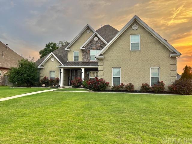 107 Marie Jeanne Dr, Maumelle, AR 72113 - view of front facade with a front lawn and a standing seam roof