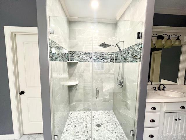 107 Marie Jeanne Dr, Maumelle, AR 72113 - full bath featuring crown molding, a shower stall, vanity, and marble look tile flooring