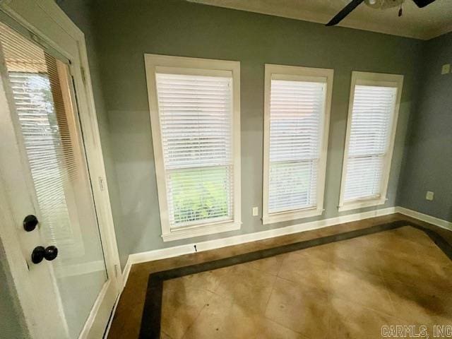 107 Marie Jeanne Dr, Maumelle, AR 72113 - tiled spare room featuring baseboards and a ceiling fan