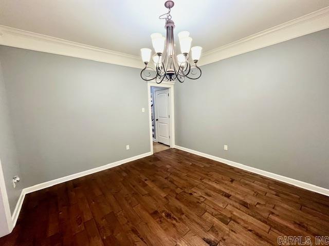 107 Marie Jeanne Dr, Maumelle, AR 72113 - spare room featuring a chandelier, crown molding, and wood finished floors