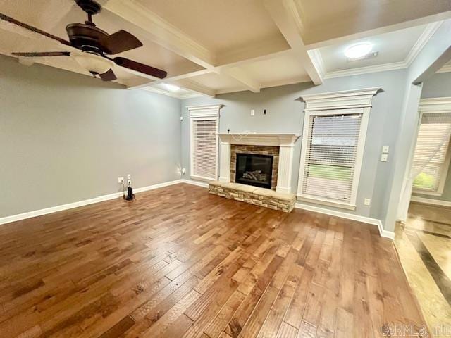 107 Marie Jeanne Dr, Maumelle, AR 72113 - unfurnished living room with ceiling fan, hardwood / wood-style floors, a stone fireplace, beam ceiling, and coffered ceiling
