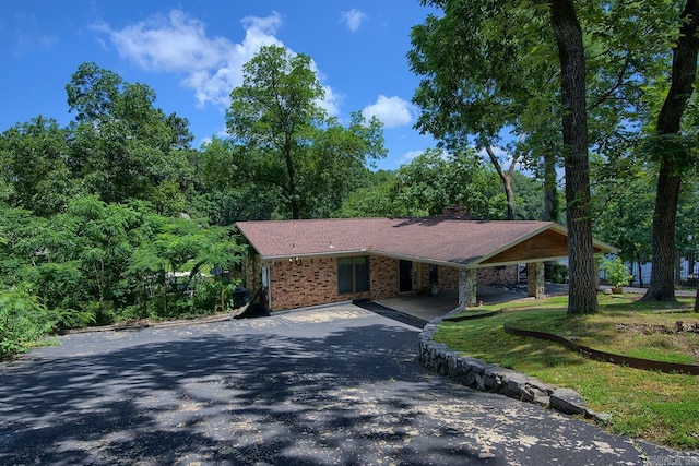 121 Atkinson Ln, Hot Springs, AR 71913 - view of front of property with driveway, brick siding, and a carport