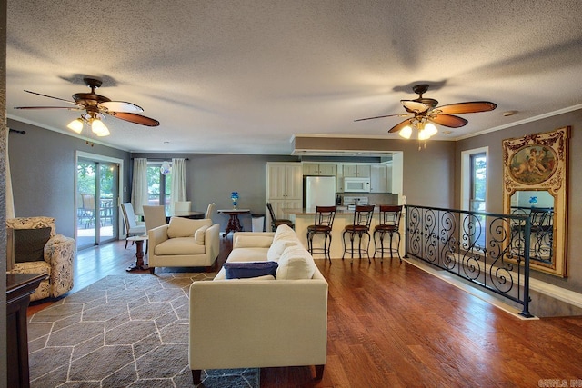 121 Atkinson Ln, Hot Springs, AR 71913 - living area with a ceiling fan, ornamental molding, a textured ceiling, and dark wood finished floors