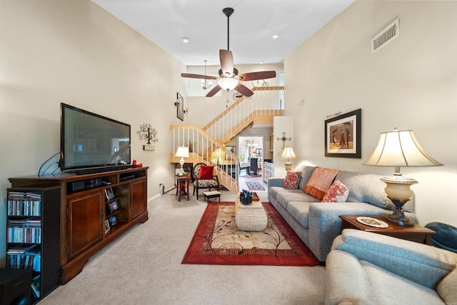 173-B Pebble Beach Pl, Hot Springs, AR 71913 - carpeted living area with stairs, ceiling fan, and a high ceiling