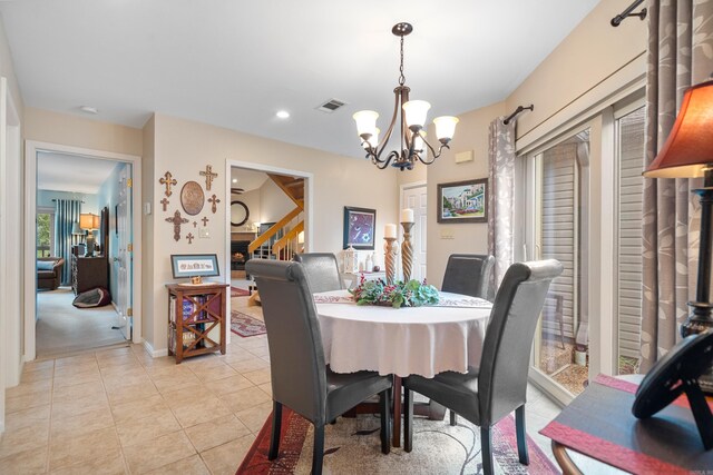 173-B Pebble Beach Pl, Hot Springs, AR 71913 - dining area with stairway, a chandelier, light tile patterned flooring, and recessed lighting