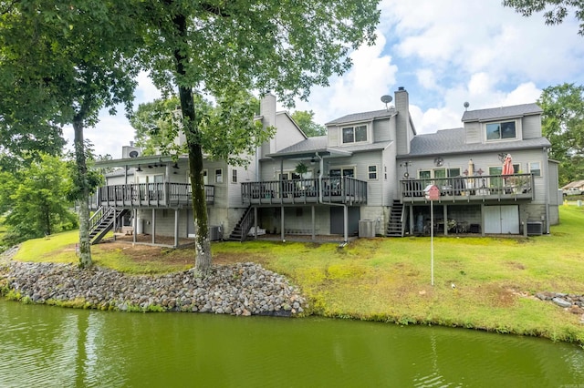 173-B Pebble Beach Pl, Hot Springs, AR 71913 - back of property with stairway, a deck with water view, and a lawn