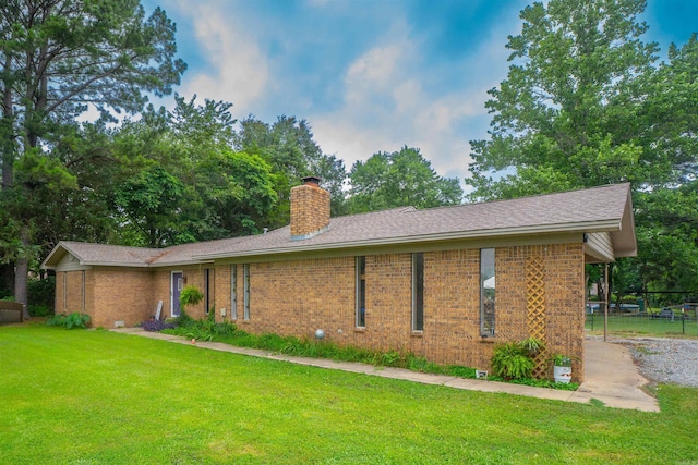 103 N Greer Dr, Searcy, AR 72143 - view of property exterior featuring brick siding, a chimney, and a shingled roof