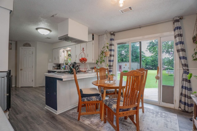 103 N Greer Dr, Searcy, AR 72143 - dining room with a textured ceiling and wood finished floors