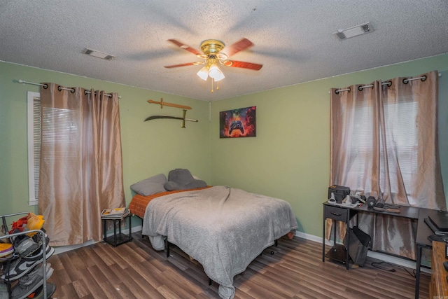 103 N Greer Dr, Searcy, AR 72143 - bedroom featuring multiple windows, wood finished floors, a textured ceiling, and ceiling fan