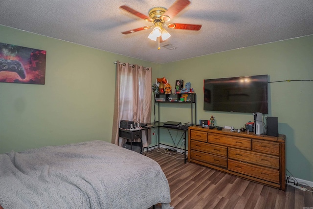 103 N Greer Dr, Searcy, AR 72143 - bedroom featuring wood finished floors, a textured ceiling, and a ceiling fan