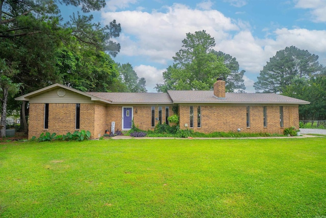 103 N Greer Dr, Searcy, AR 72143 - ranch-style house with brick siding, a front yard, and a chimney