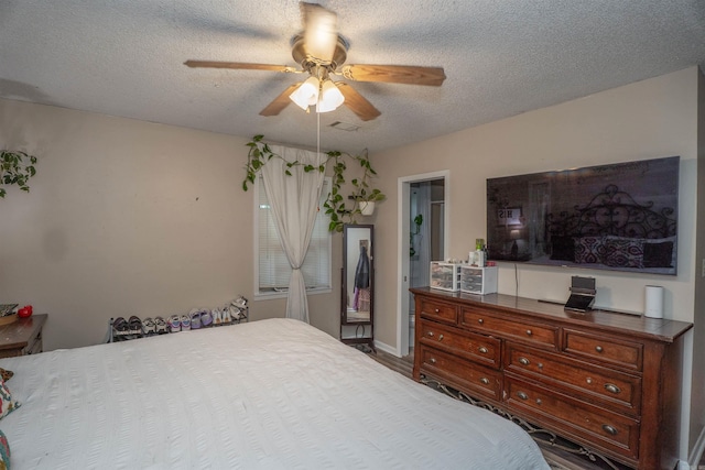 103 N Greer Dr, Searcy, AR 72143 - bedroom featuring a textured ceiling and a ceiling fan