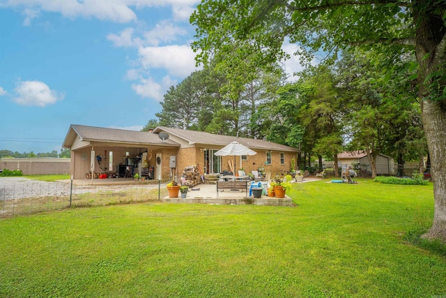 103 N Greer Dr, Searcy, AR 72143 - back of house with a lawn, a patio, and an outdoor hangout area