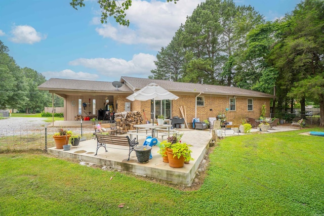 103 N Greer Dr, Searcy, AR 72143 - rear view of property with a patio and brick siding