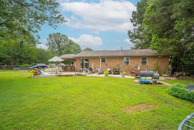 103 N Greer Dr, Searcy, AR 72143 - rear view of house with a patio, brick siding, and an outdoor hangout area