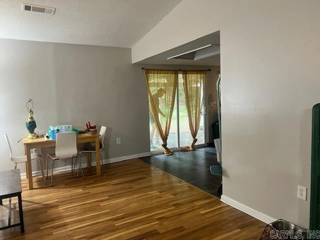4 Brookway Ln, North Little Rock, AR 72120 - dining area with wood finished floors and a textured ceiling
