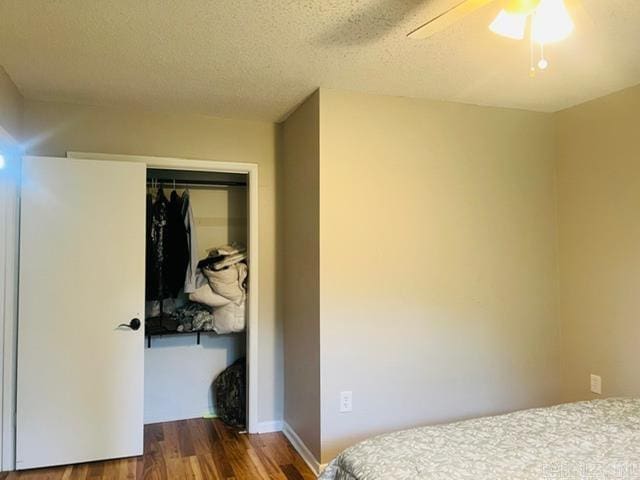 4 Brookway Ln, North Little Rock, AR 72120 - bedroom with wood finished floors, a closet, a textured ceiling, and ceiling fan
