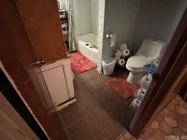 1901 S Buerkle St, Stuttgart, AR 72160 - bathroom with tile patterned flooring and bathing tub / shower combination