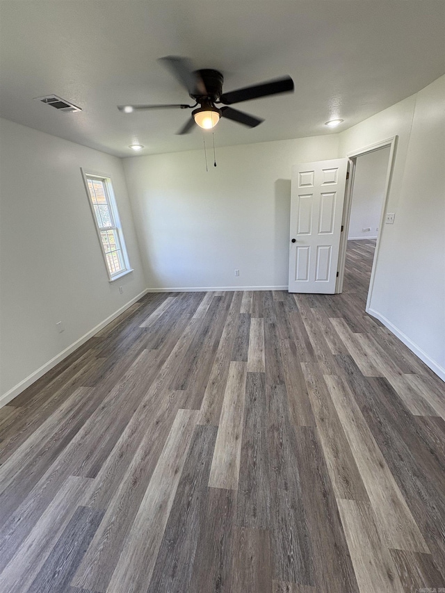 1901 N 19th St, Paragould, AR 72450 - unfurnished room with a ceiling fan and dark wood-style floors