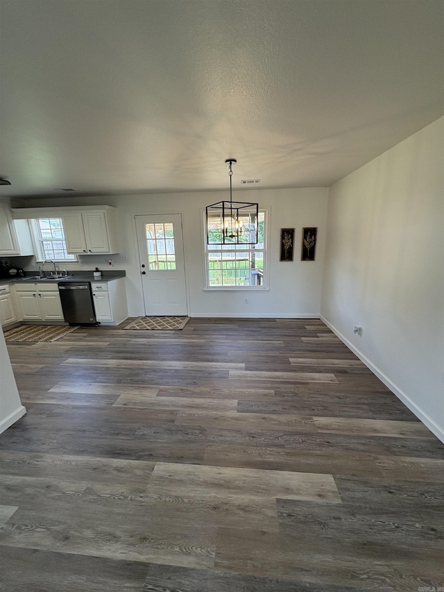 1901 N 19th St, Paragould, AR 72450 - unfurnished dining area featuring dark wood-type flooring and a chandelier